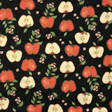COTON IMPRIMÉ POMMES FOND NOIR