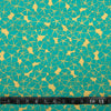 COTON IMPRIMÉ FLEUR TURQUOISE SUR FOND OR